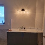 Wiring and installed bathroom vanity lighting.