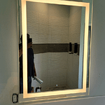 Installed customer supplied vanity lights over mirrors in Estero